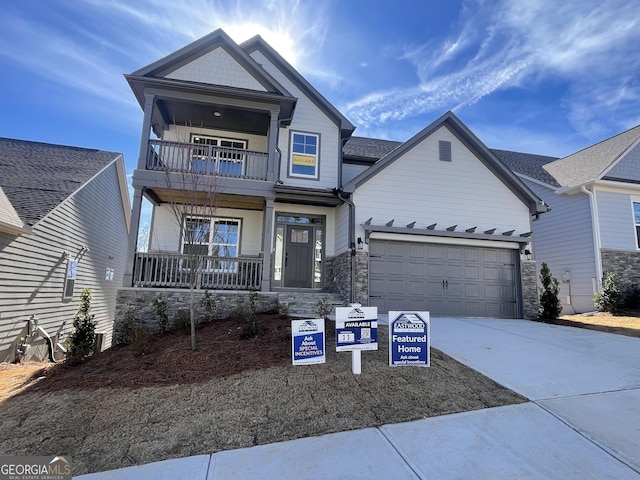 craftsman-style home featuring a garage and a porch