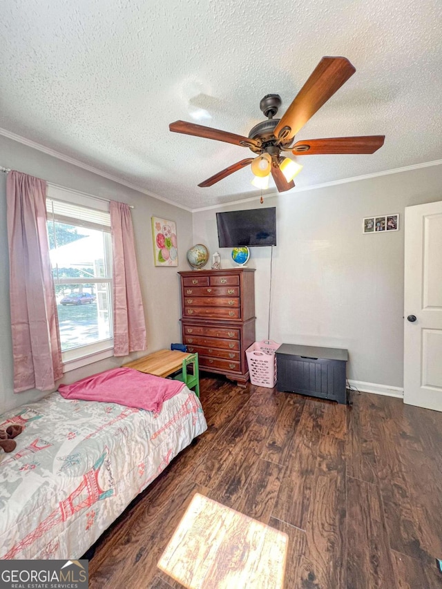 bedroom featuring ceiling fan, dark hardwood / wood-style flooring, crown molding, and a textured ceiling