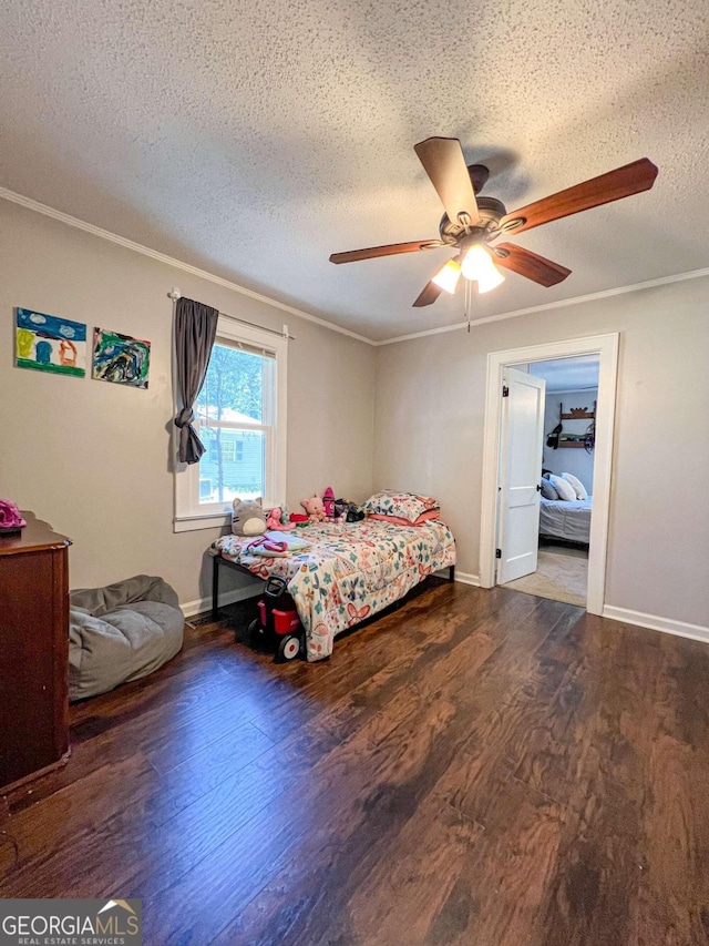 bedroom featuring ceiling fan, dark hardwood / wood-style flooring, and a textured ceiling