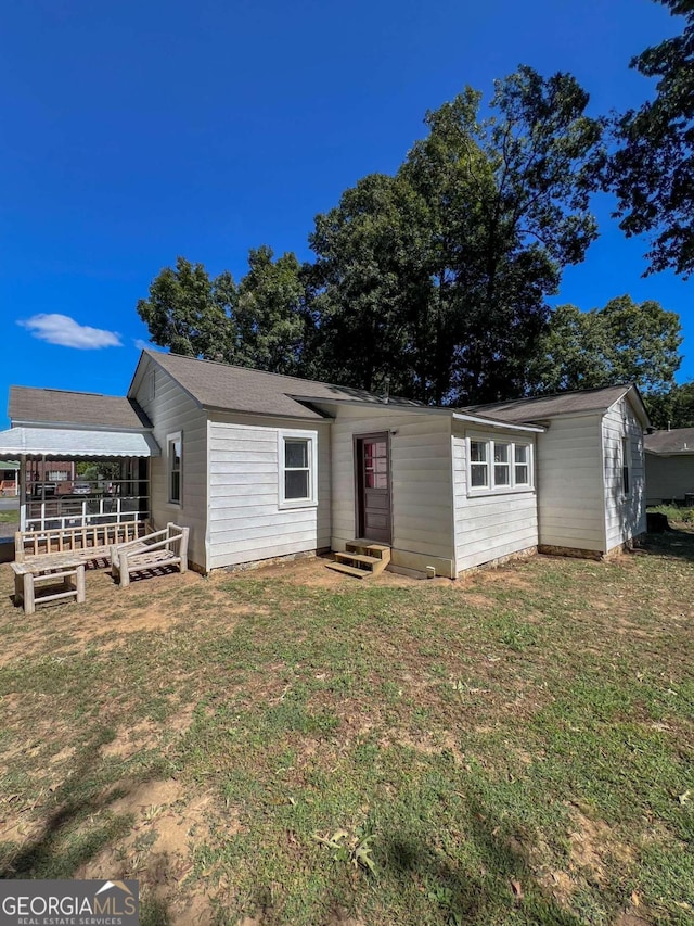 view of front of home with a front yard