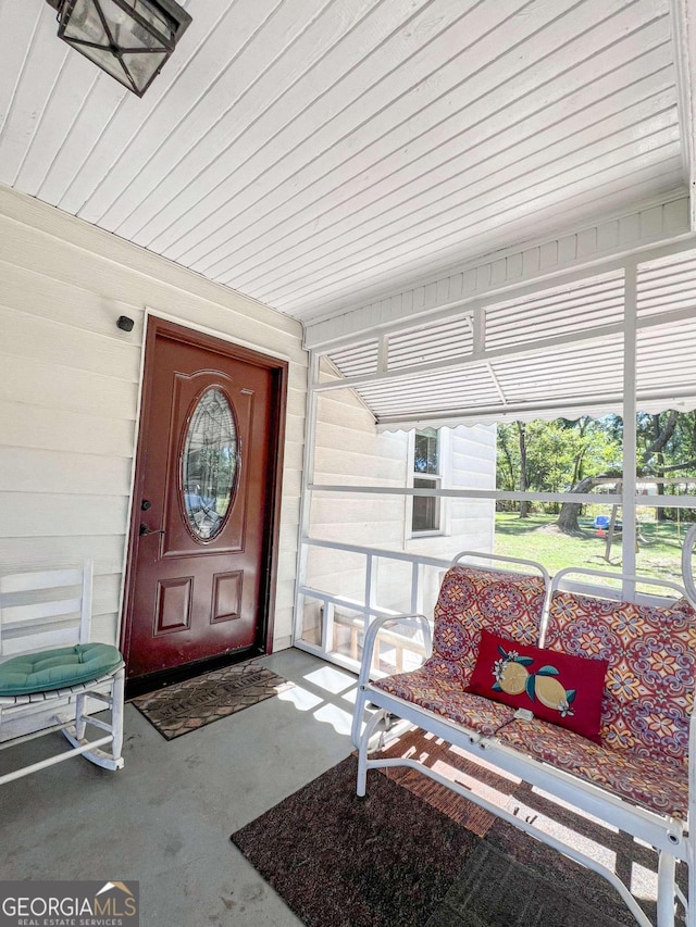 doorway to property featuring a porch