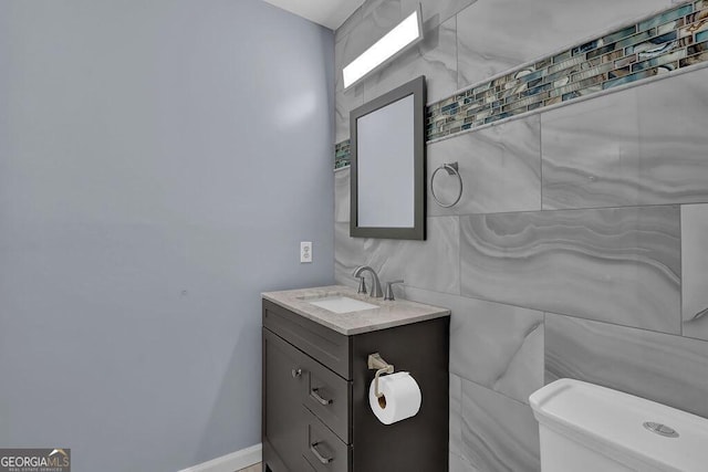 bathroom with toilet and vanity