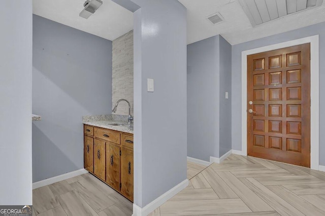 interior space featuring parquet floors and vanity