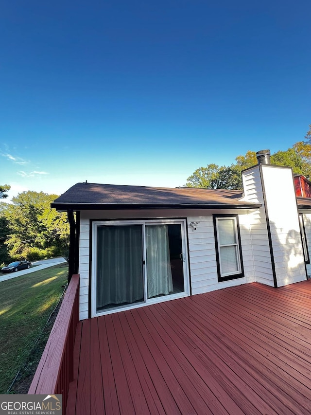 deck featuring a yard