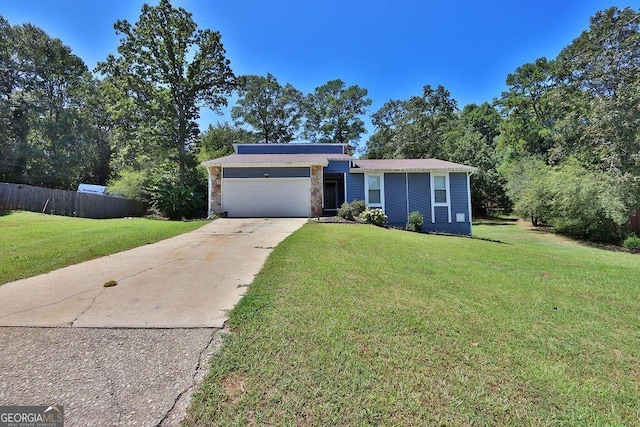 single story home with a garage and a front yard