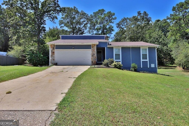 ranch-style house featuring concrete driveway, fence, a garage, and a front lawn