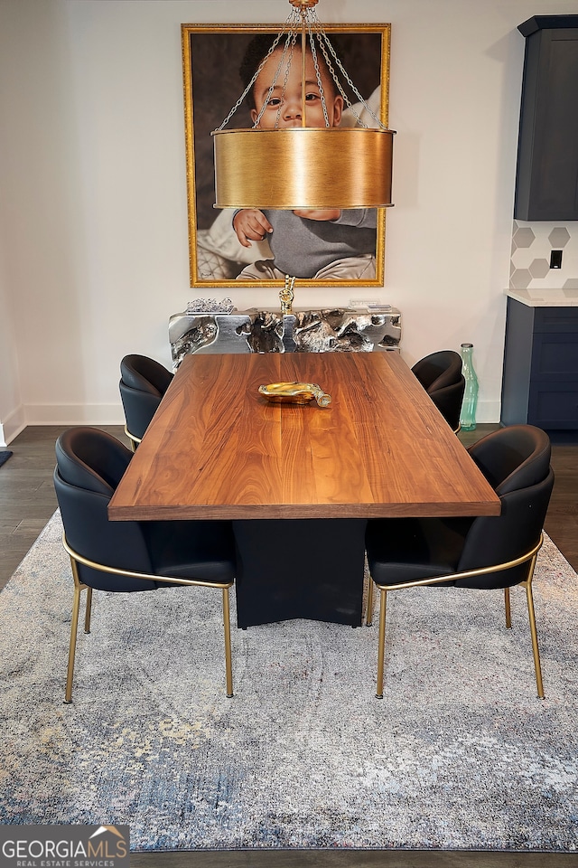 dining area featuring dark hardwood / wood-style flooring