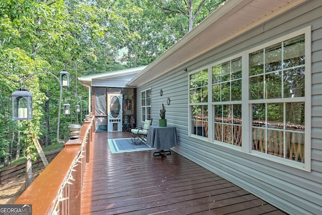 deck with a sunroom