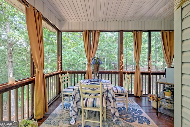 unfurnished sunroom featuring wood ceiling