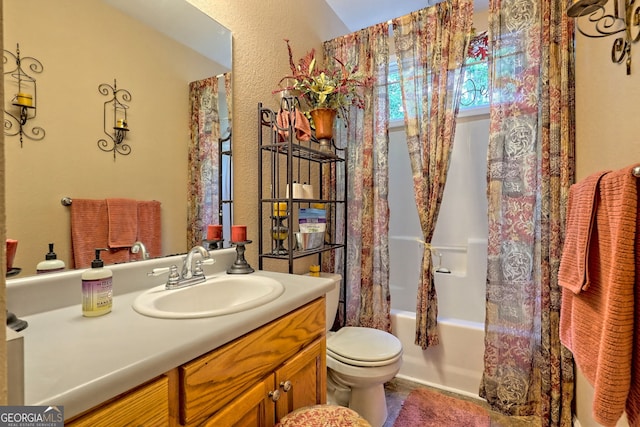 full bathroom with vanity, toilet, and shower / tub combo with curtain