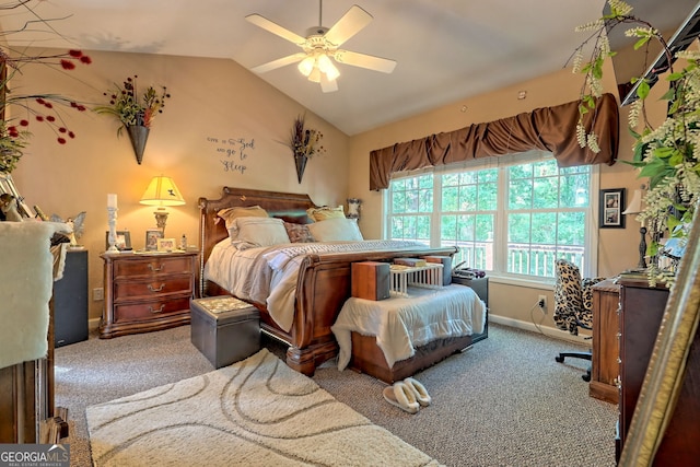 bedroom with carpet flooring, vaulted ceiling, and ceiling fan