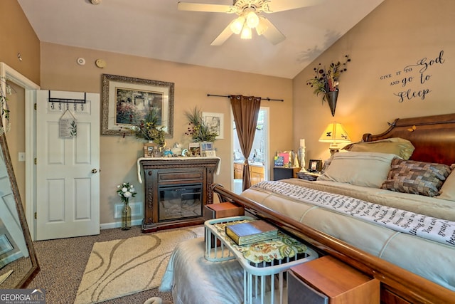 carpeted bedroom featuring ceiling fan and vaulted ceiling