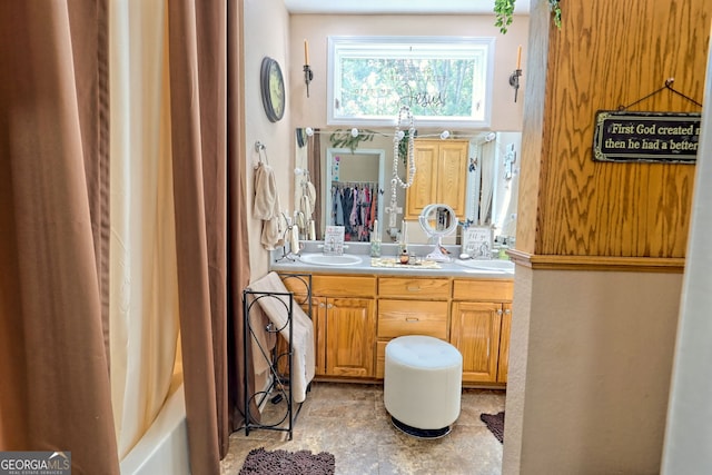 bathroom with vanity and shower / tub combo