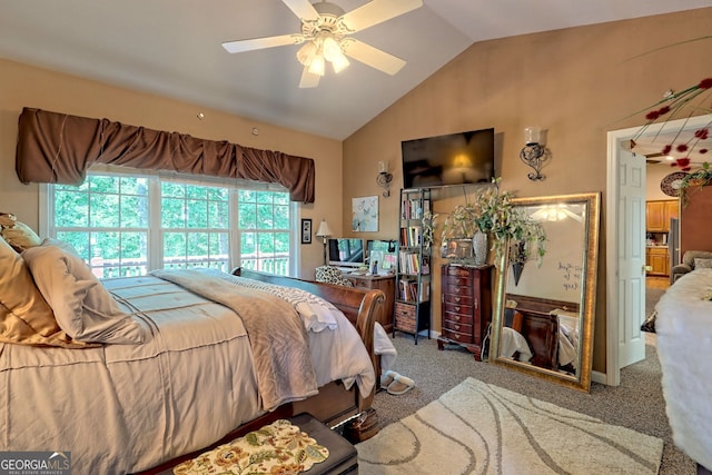 carpeted bedroom with ceiling fan and vaulted ceiling