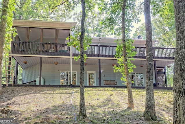 back of property featuring a sunroom