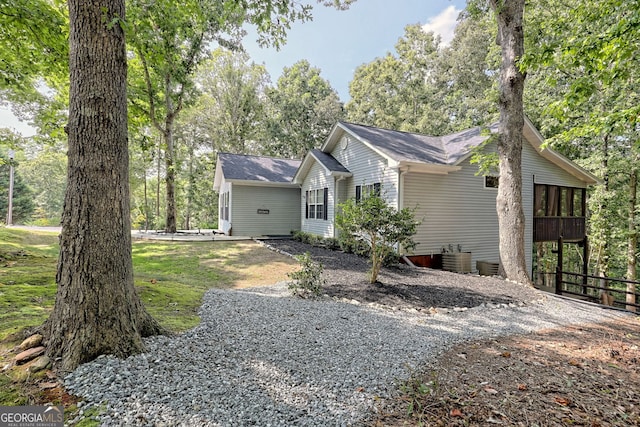 view of side of home with a sunroom