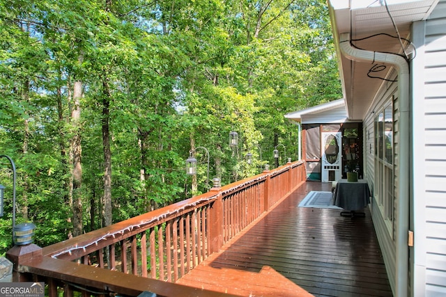 wooden deck featuring a sunroom