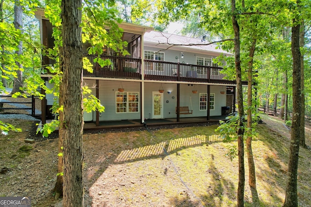 back of property with a deck