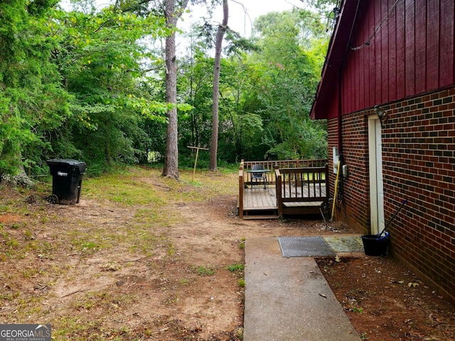 view of yard with a deck