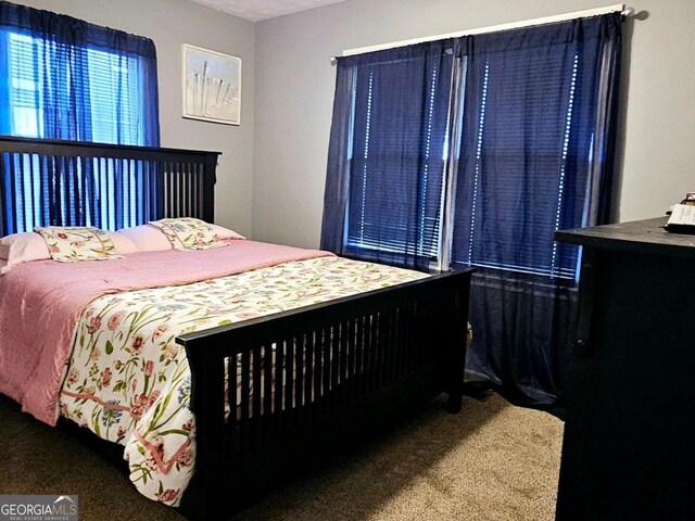 bedroom featuring carpet