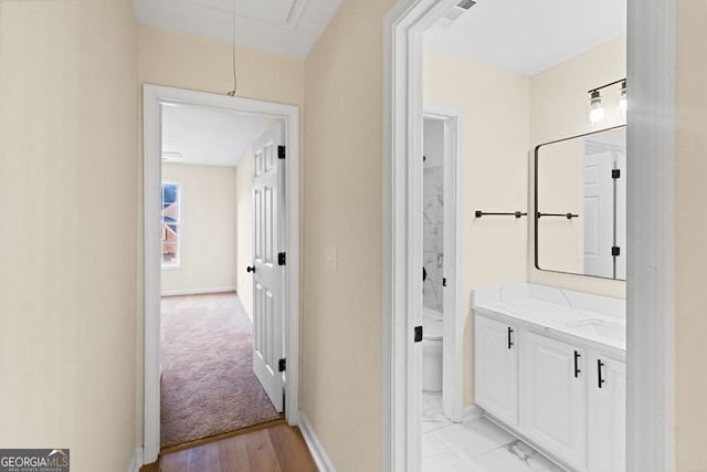 bathroom featuring toilet, baseboards, visible vents, and vanity