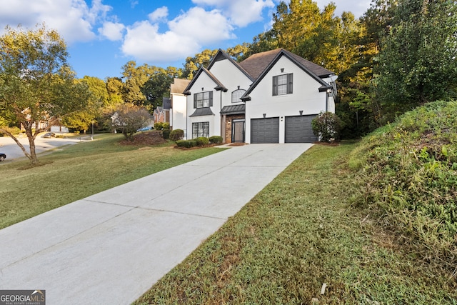 tudor-style house with a garage and a front lawn