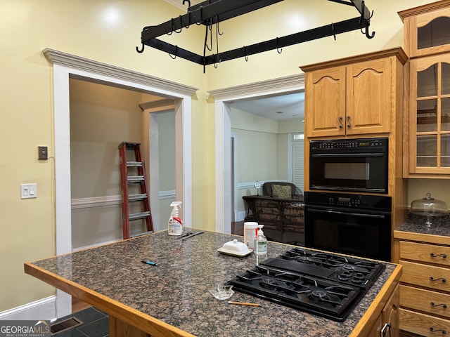 490 Hill St SE, Atlanta, GA 30312 - kitchen with tile patterned flooring and black appliances