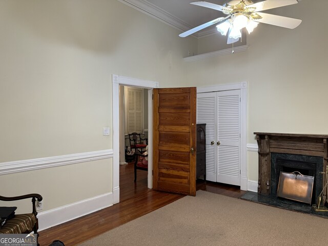 490 Hill St SE, Atlanta, GA 30312 - living room with crown molding, dark wood-type flooring, ceiling fan, and a premium fireplace
