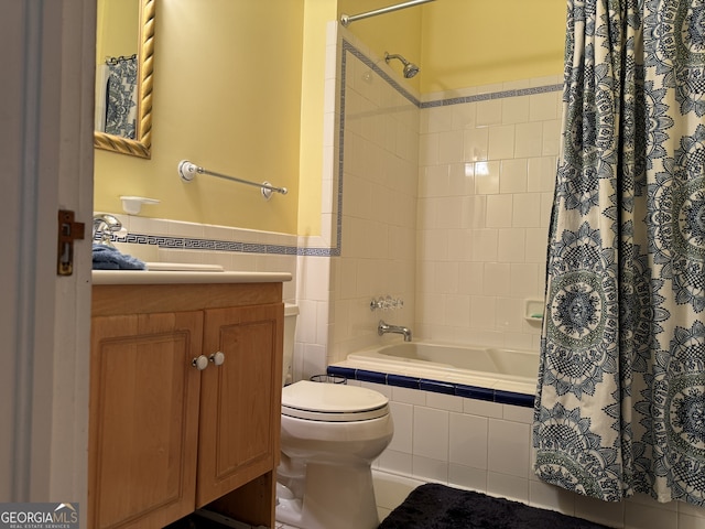 490 Hill St SE, Atlanta, GA 30312 - full bathroom with tile patterned flooring, toilet, tile walls, shower / bath combination with curtain, and vanity