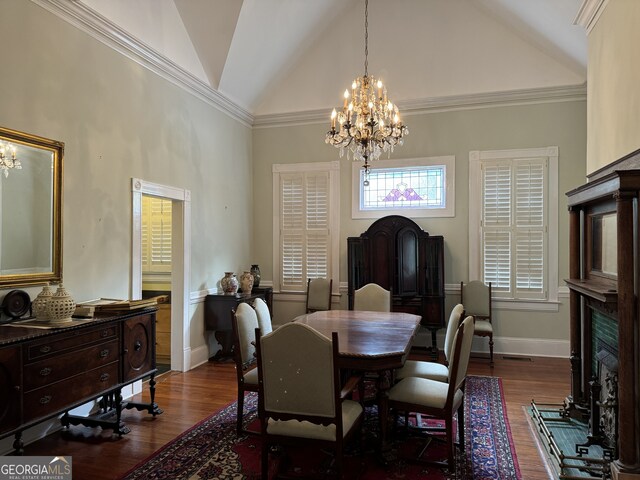 490 Hill St SE, Atlanta, GA 30312 - dining room with dark wood-type flooring, high vaulted ceiling, a chandelier, and ornamental molding