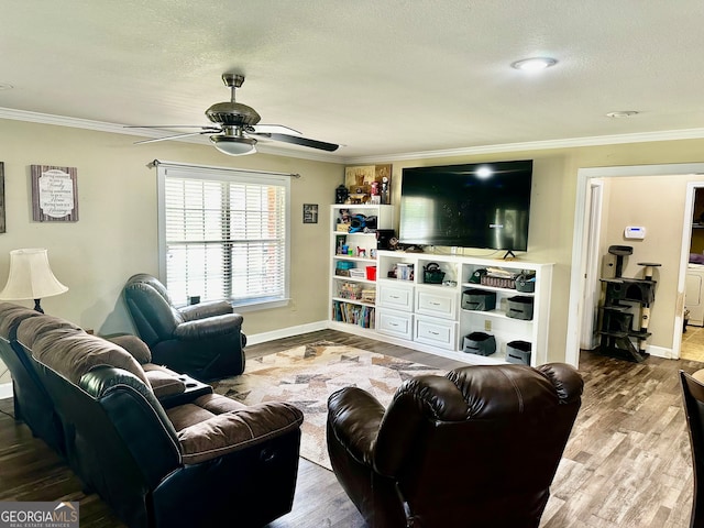 living room with ornamental molding, hardwood / wood-style floors, and ceiling fan