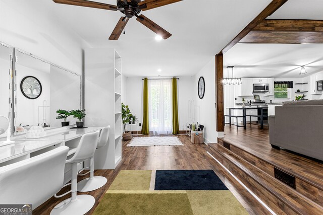 entryway featuring plenty of natural light, ceiling fan, and dark hardwood / wood-style flooring