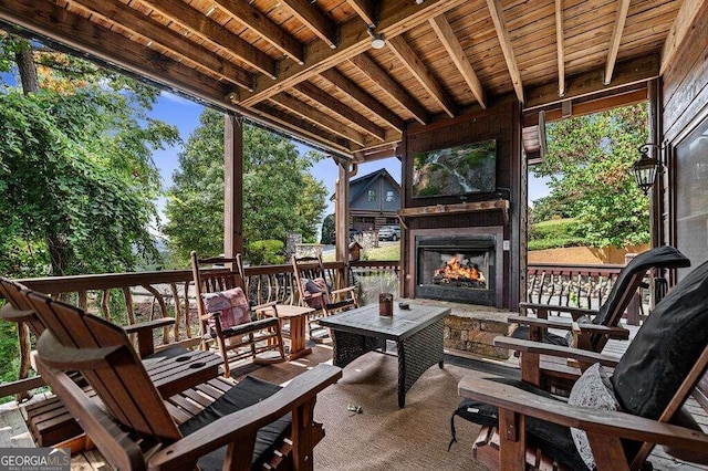 exterior space featuring an outdoor stone fireplace