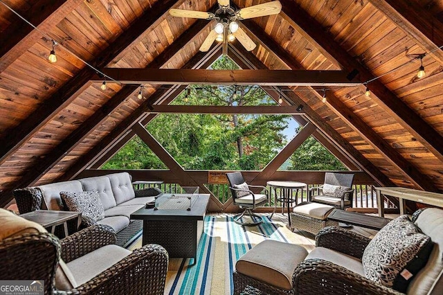 living room featuring wood ceiling, lofted ceiling with beams, and ceiling fan