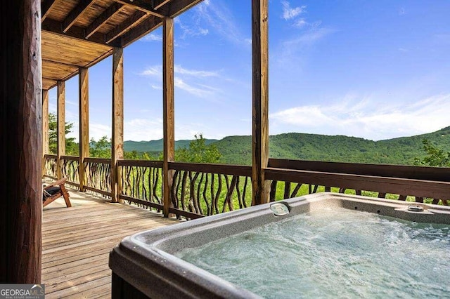 unfurnished sunroom with a hot tub, wooden ceiling, and vaulted ceiling with beams