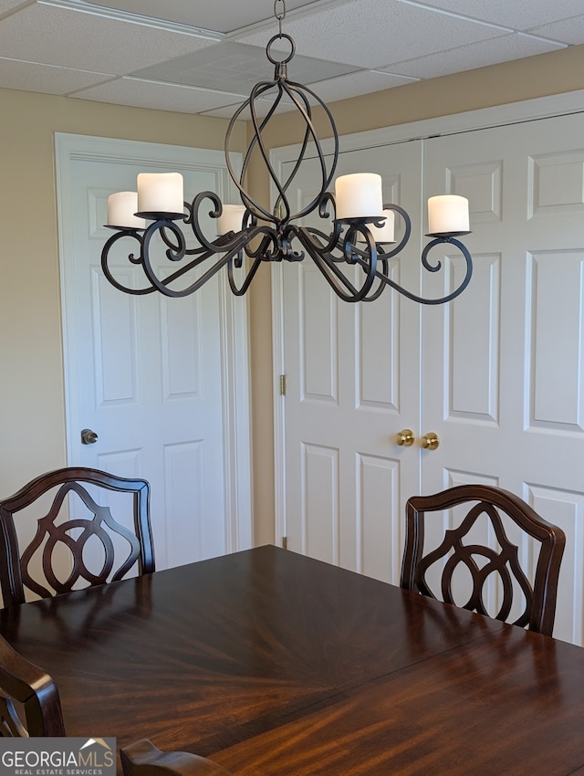 dining space featuring a drop ceiling