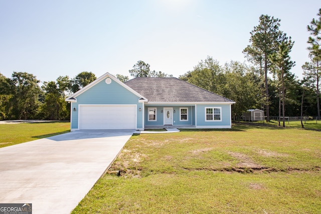 ranch-style house featuring a garage, a front yard, and a storage shed