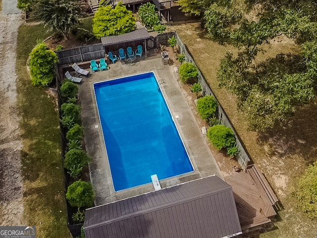 view of pool featuring a diving board and a patio area