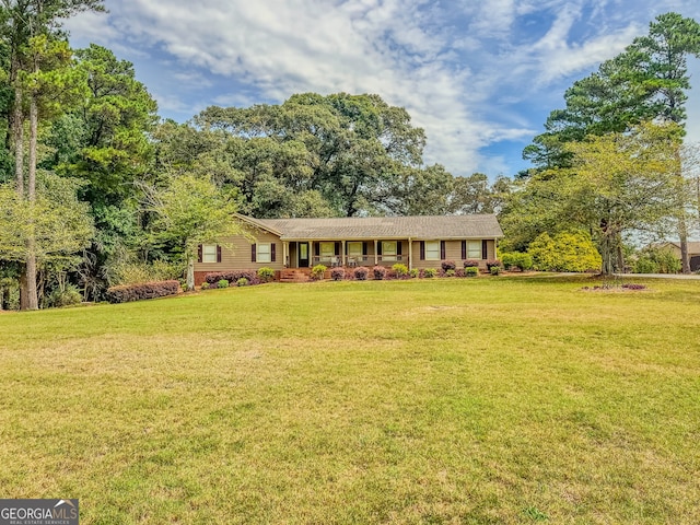 ranch-style house with a front lawn