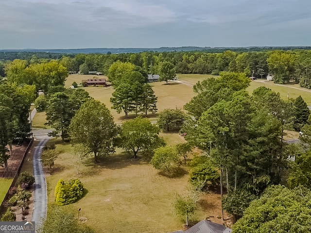 birds eye view of property with a rural view