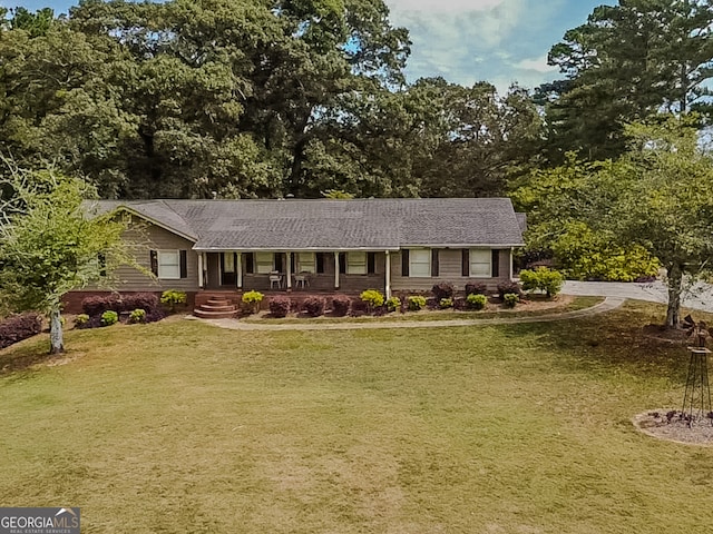 ranch-style house featuring a front yard and a porch