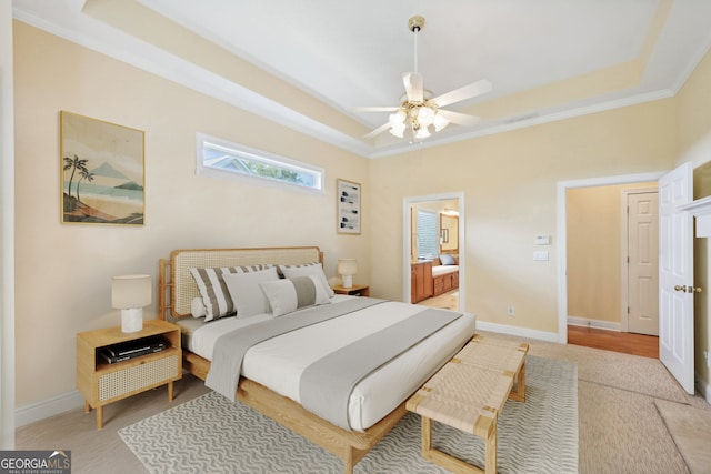 bedroom with ornamental molding, a raised ceiling, and ceiling fan