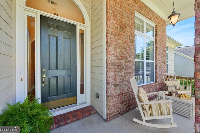 property entrance with covered porch