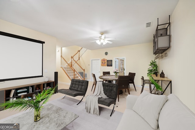 interior space with ceiling fan