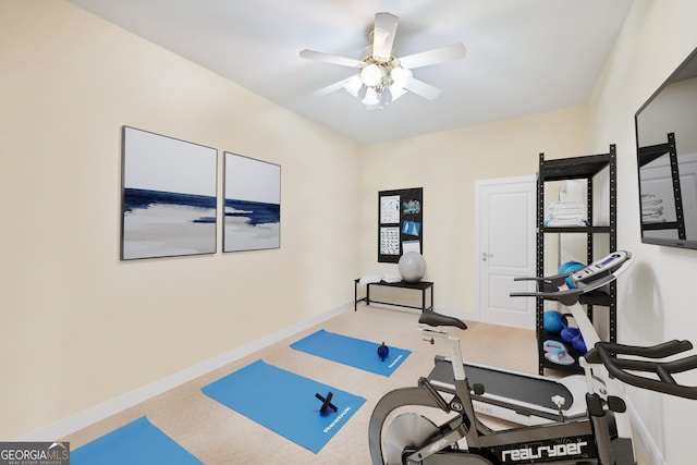 exercise area featuring carpet flooring and ceiling fan