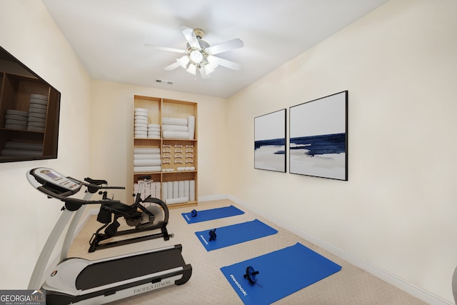 exercise room featuring carpet flooring and ceiling fan