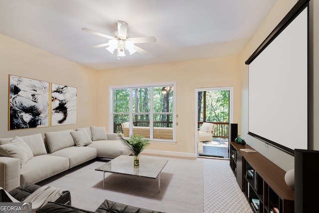 carpeted living room featuring ceiling fan