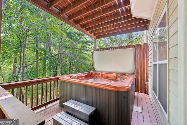 wooden terrace featuring a hot tub