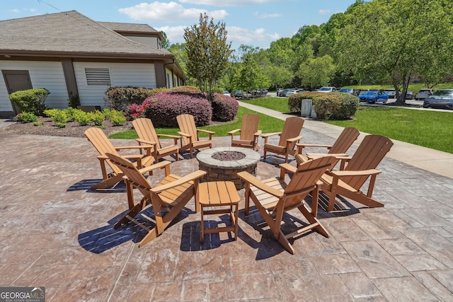 view of patio / terrace featuring an outdoor fire pit