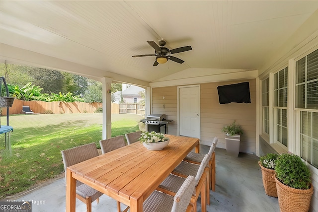 view of patio featuring a ceiling fan, outdoor dining area, a fenced backyard, and grilling area